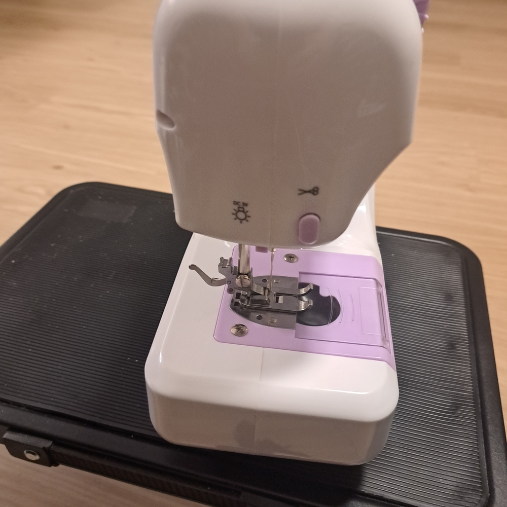 Compact White and Lavender Portable Sewing Machine - Picture 3 of 11